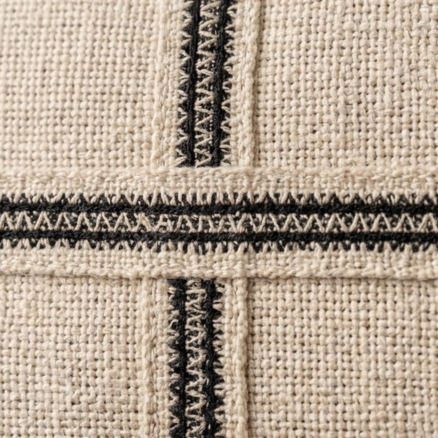 Minimal decorative pillow with black grid pattern