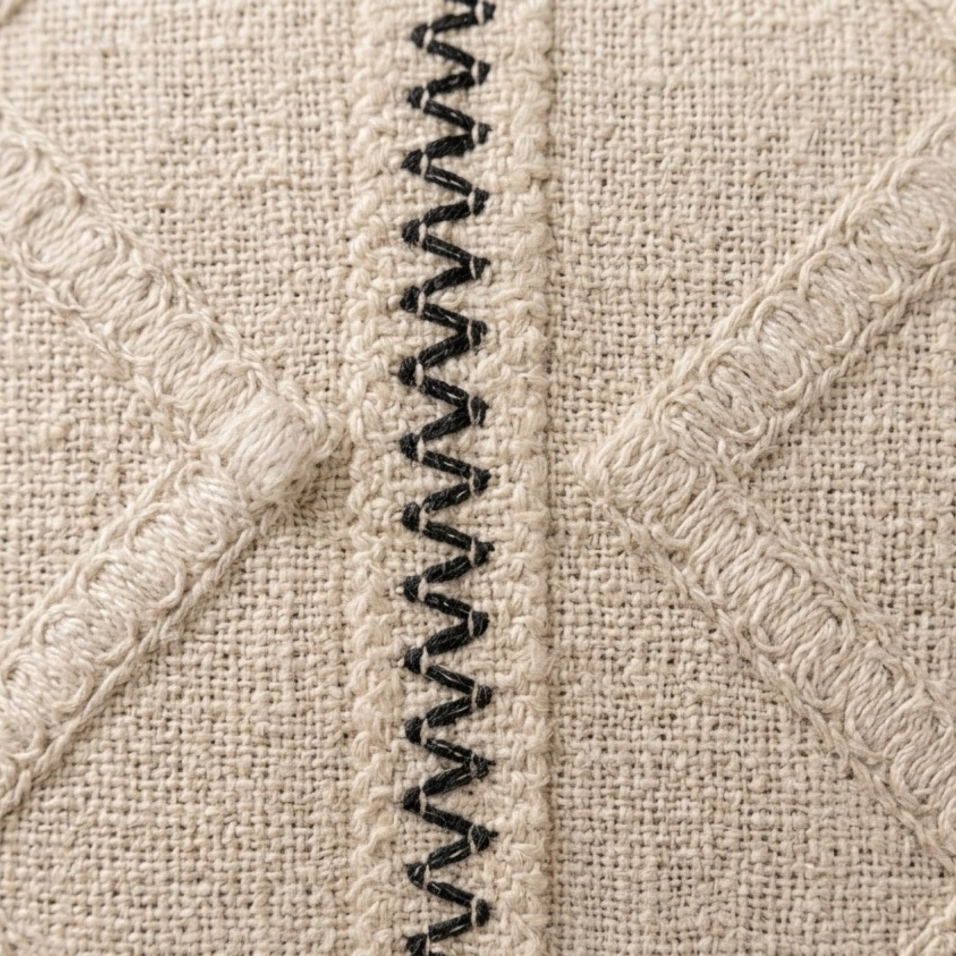 Neutral cotton cushion cover with embroidered geometric design