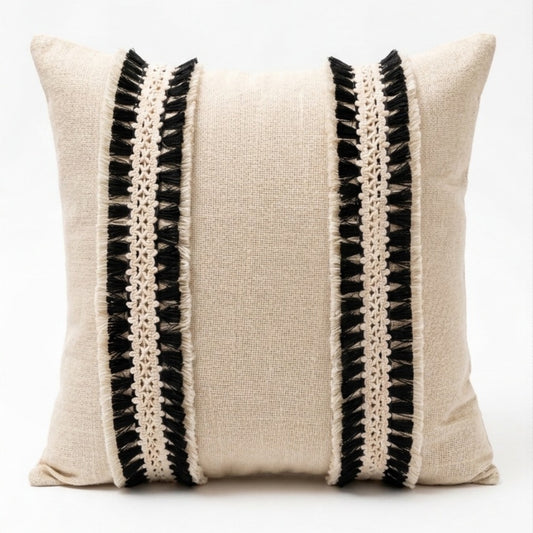 Decorative pillow with black and white striped pattern on a white background